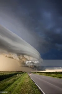 A cloud barrier type arcus over a road